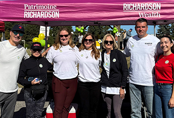Kelly and team outside the pink Richardson Wealth tent.